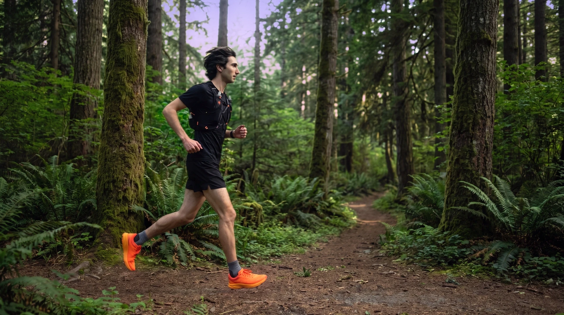 Cade running a forest trail